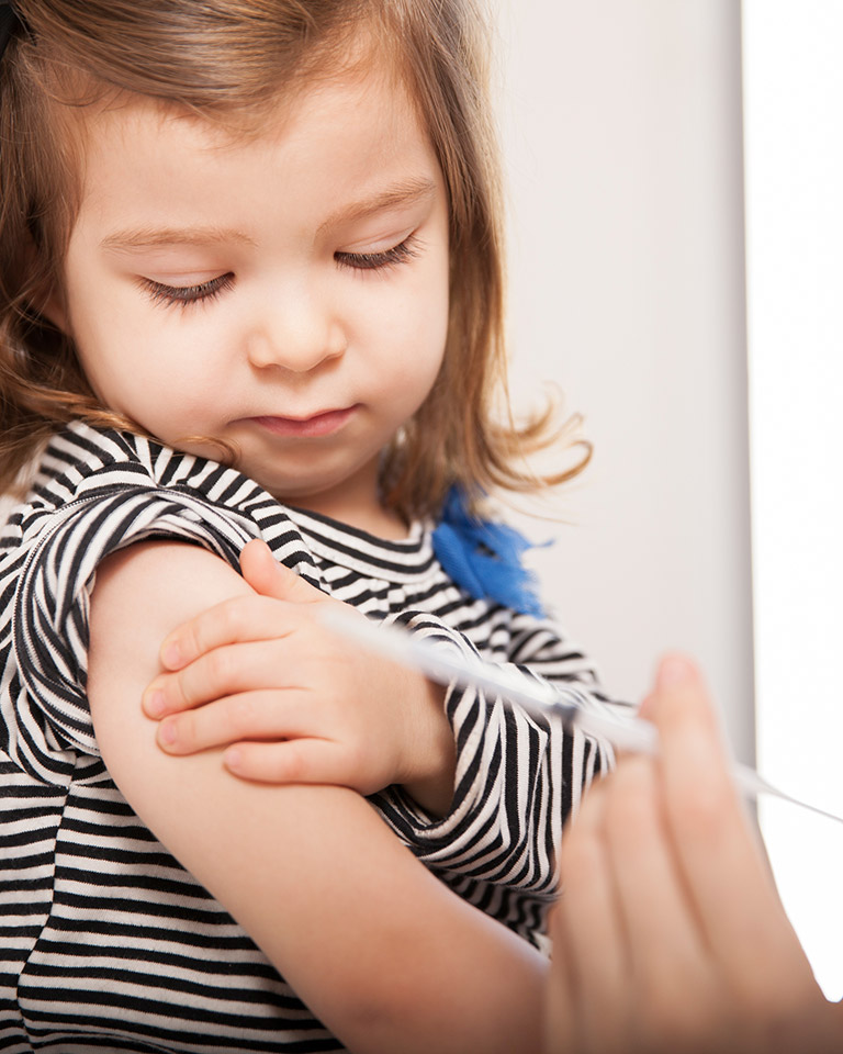 little girl getting a vaccination