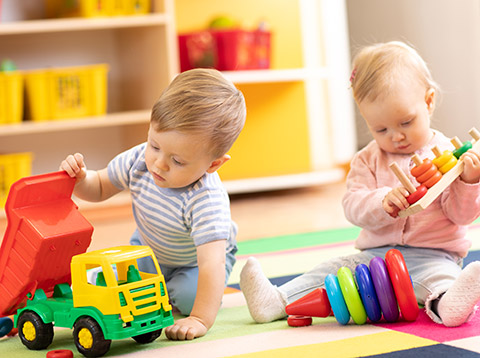 boy and girl toddlers playing